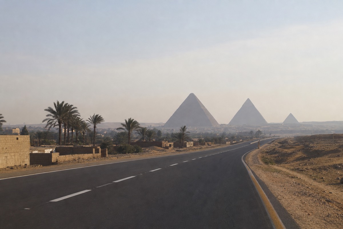 The desert road approach toward the Grand Egyptian Museum on the Giza plateau near Cairo