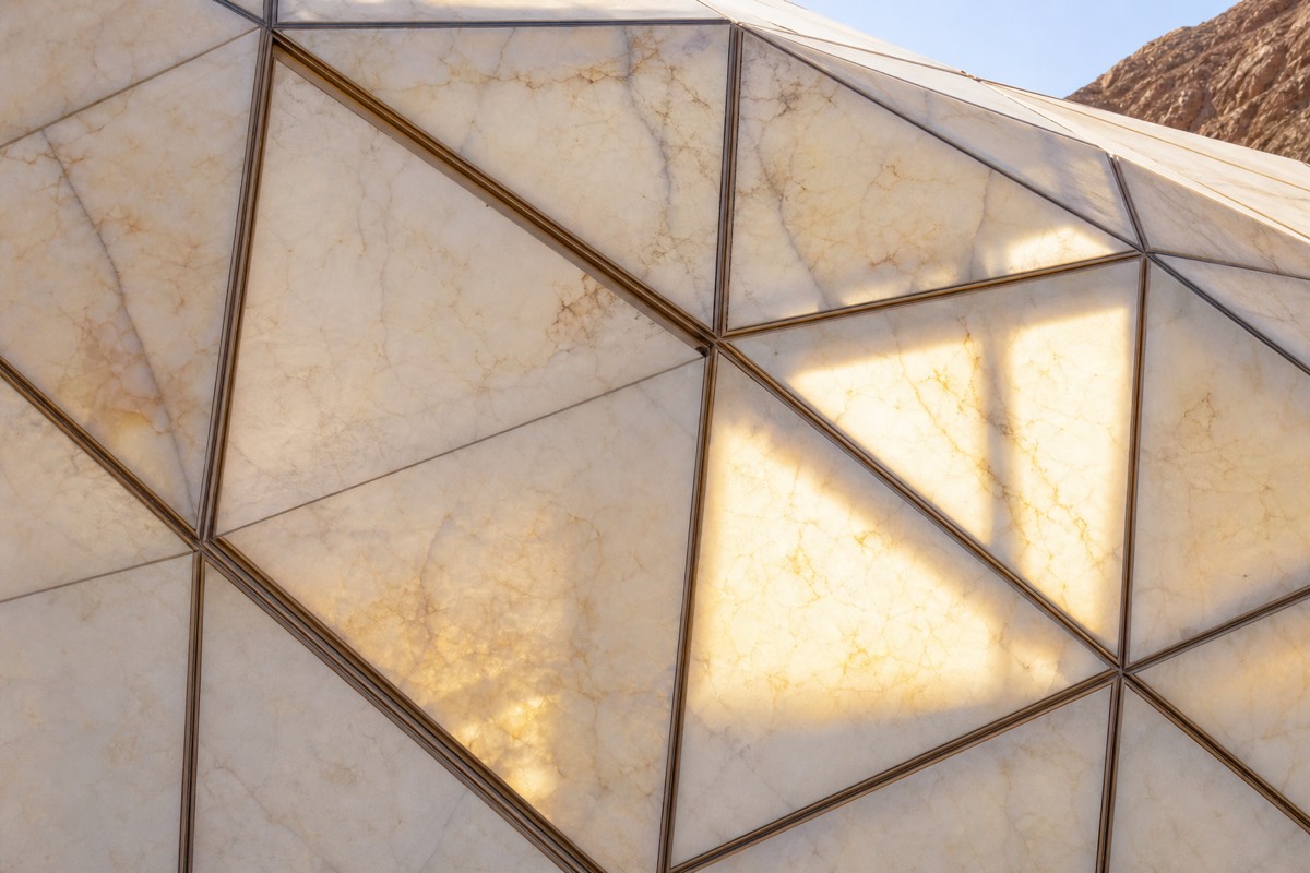 The translucent stone facade of the Grand Egyptian Museum