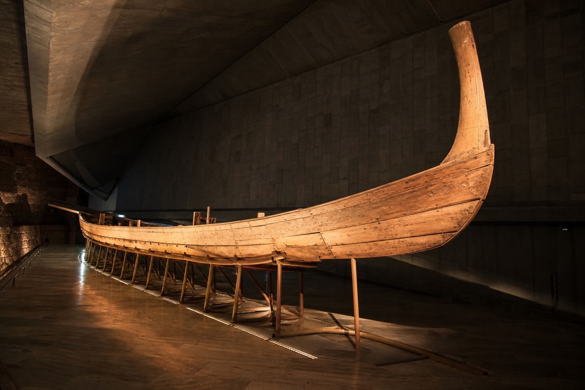 The reconstructed Khufu Solar Boat displayed in its own hall at the Grand Egyptian Museum
