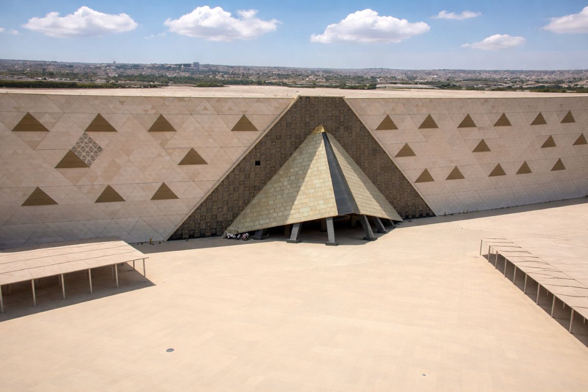 Exterior view of the Grand Egyptian Museum with pyramid-inspired architecture visited during a tour with The Grand Egyptian Museum Tickets